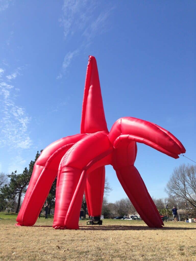 The Eagle has Landed, HOMECOMING! Committee, 2014: looking up at the red inflatable eagle against a clear blue sky